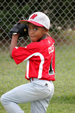 youth pitching a baseball