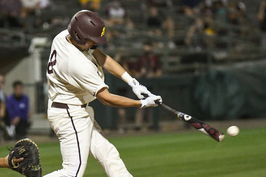 baseball hitter hitting a baseball
